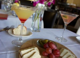 The Happiest of Hours: Martin’s is a Key West Favorite - A plate of food with a glass of wine - Martin's