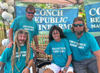 Conch Republic Marine Army keeps growing - A group of people posing for the camera - Conch Republic