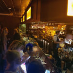 Berlin’s: A Key West Classic Bar With a Twist of Something New - A group of people standing in a room - Salut! Classic bar