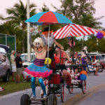 Zombie Invasion - A group of people riding on the back of a colorful umbrella - Car