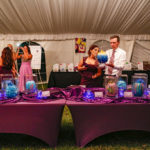 Purple Pumpkin Gala - A group of people sitting at a table - Founders Park