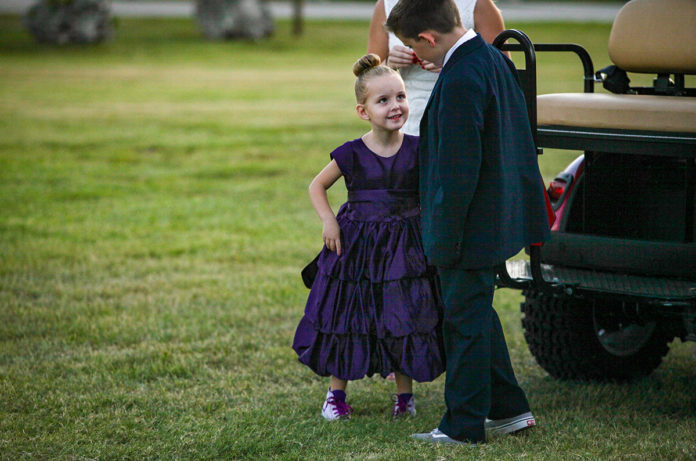 Purple Pumpkin Gala - A little girl that is standing in the grass - Founders Park