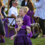 Purple Pumpkin Gala - A little girl holding a football ball - Founders Park