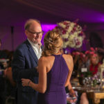 Purple Pumpkin Gala - A person standing on a stage - Wedding reception