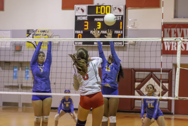 Local Sports: Marathon Volleyball Girls Head to District as 2 Seed - A group of people playing a game of volleyball - Volleyball