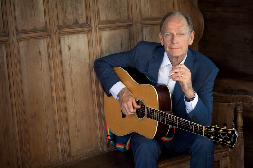 Livingston Taylor Plays the Key West Theater - Livingston Taylor holding a guitar - Livingston Taylor
