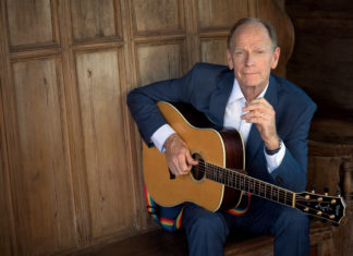 Livingston Taylor Plays the Key West Theater - Livingston Taylor holding a guitar - Livingston Taylor