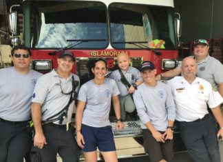 7 Year Old Jesse Santerre. Courage, Inspiration…Firefighter - A group of people posing for the camera - Erika Olivera