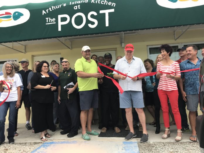 A NEW BEGINNING – VFW Post opens in Key Largo - A group of people standing in front of a crowd posing for the camera - Key West