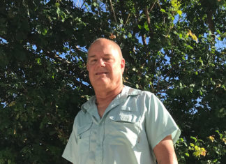 20 Questions With Chris Sante - A man standing in front of a forest - Islamorada
