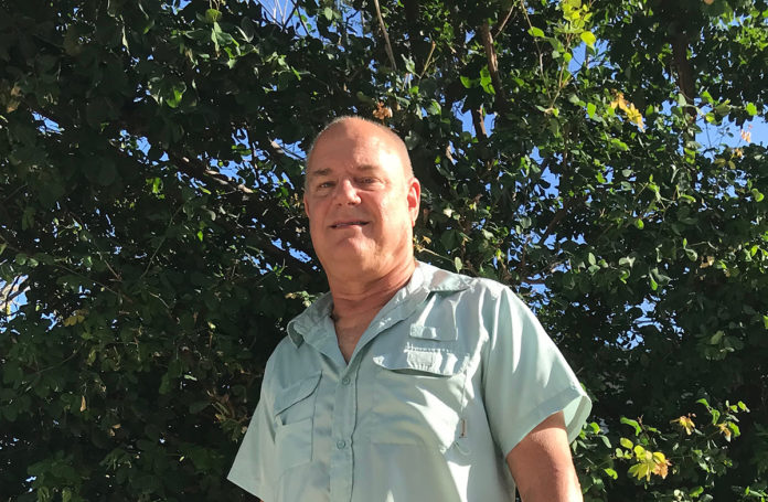 20 Questions With Chris Sante - A man standing in front of a forest - Islamorada