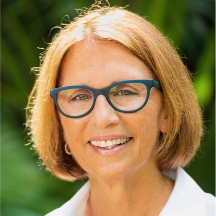 Teri Johnston Elected First Openly Gay Female Mayor of Key West - A woman wearing glasses and smiling at the camera - Teri Johnston