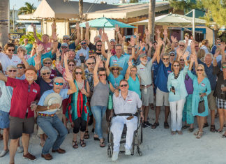 Key West is Isolated, but Exemplary - A group of people standing in front of a crowd posing for the camera - Teri Johnston
