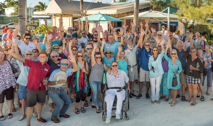 Key West is Isolated, but Exemplary - A group of people standing in front of a crowd posing for the camera - Teri Johnston