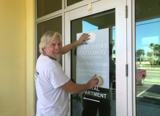 Major Deal: Berkshire Hathaway Purchases ACRE in Marathon & Lower Keys - A person standing in front of a door - Key West
