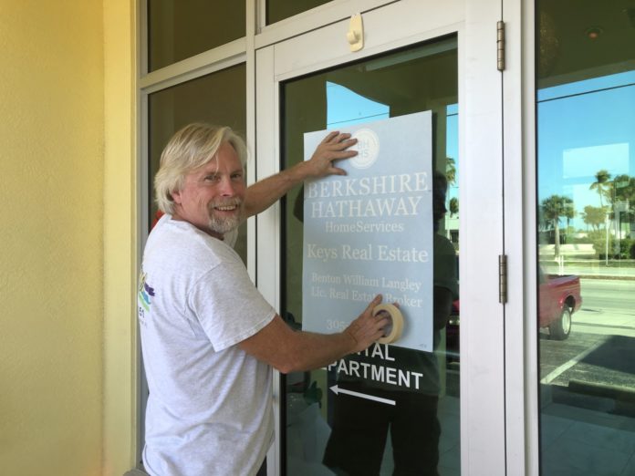 Major Deal: Berkshire Hathaway Purchases ACRE in Marathon & Lower Keys - A person standing in front of a door - Key West