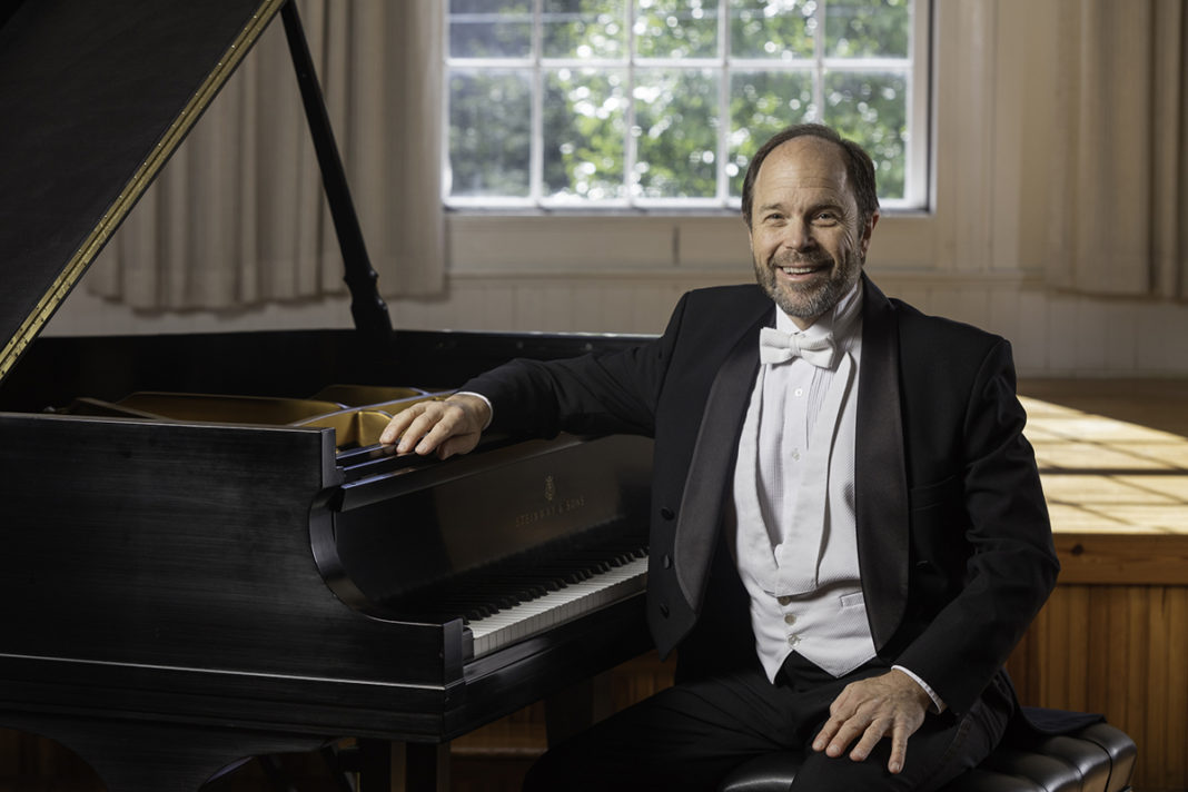 Moyer Jazz Trio visits Keys - Fred Moyer sitting in front of a piano - Frederick Moyer