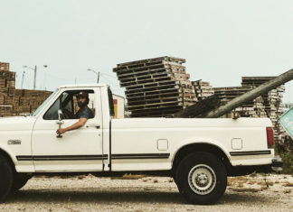 COAST: New Horizons. Original Roots. Rustic Vibes - A truck is parked in front of a car - Ford F-Series
