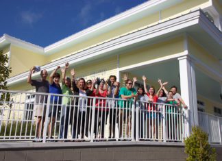 Two Paws Up! New Florida Keys SPCA Facility Opens - A group of people standing in front of a building - Florida Keys