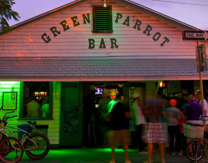 The Ultimate Bucket List: Sloan’s picks for best of Key West - A bicycle parked in front of a store - Green Parrot Bar