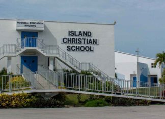 Island Christian School Fights to Survive - A sign on the side of a building - Island Christian School