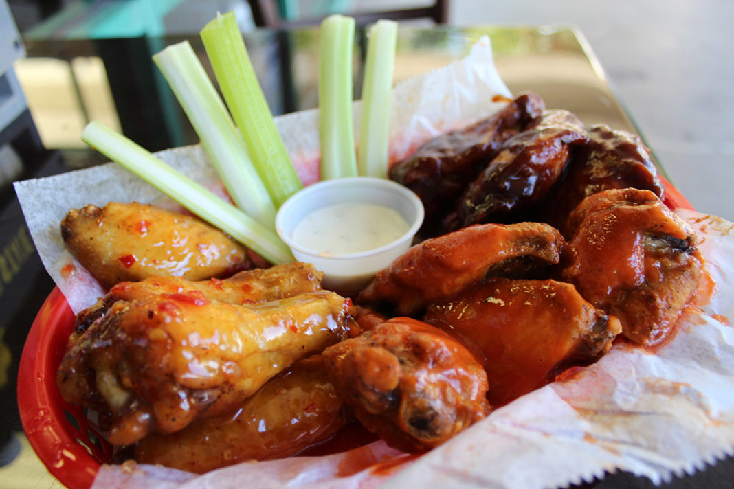 Hot pizza, saucy wings at Key Largo pizzeria - A plate of food - Kai yang