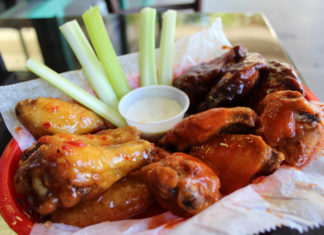 Hot pizza, saucy wings at Key Largo pizzeria - A plate of food - Kai yang