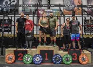 Local athletes conquer fitness competition - A group of people posing for the camera - Powerlifting