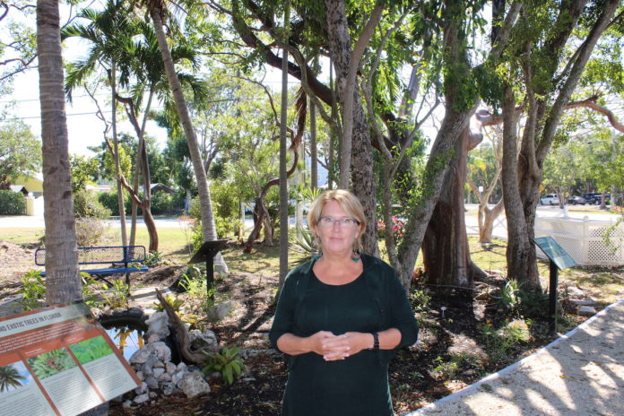 REEF director hits the ground running - A person standing next to a tree - Tree