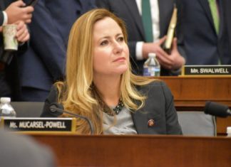 Notes from the Hill: Rep. Debbie Mucarsel-Powell gives the Weekly a report on the action in D.C. - A woman talking on a cell phone - Debbie Mucarsel-Powell