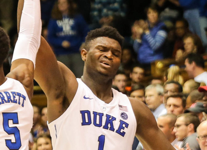 Our Top 10 “DONTS” for Your 2019 NCAA Basketball Tournament - A baseball player holding a ball in front of a crowd - Zion Williamson
