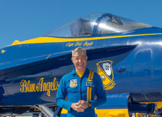 Exclusive Interview with a Blue Angel - A man standing in front of a plane - Blue Angels