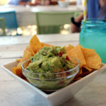 Keys Eats: Bad Boy Burrito - A bowl of food sitting on a table - Guacamole