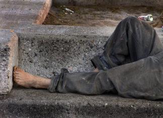 Homeless in Paradise Part 1 - A person lying on the ground - Homelessness services
