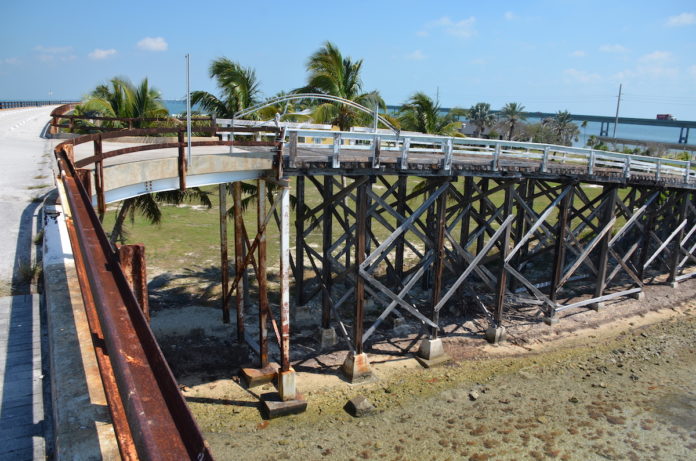 EXACT REPLICA – Pigeon Key’s Wooden Bridge undergoing extensive rehabilitation. - A bridge over a body of water - /m/083vt