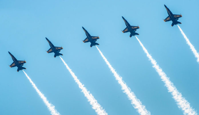 Blue Angels take the skies next weekend, full schedule and info at the link! - A fighter jet flying in the air - Blue Angels
