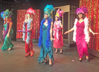 ‘La Cage Aux Folles’ explores human ties with humor and song - A group of people wearing costumes - Folk dance
