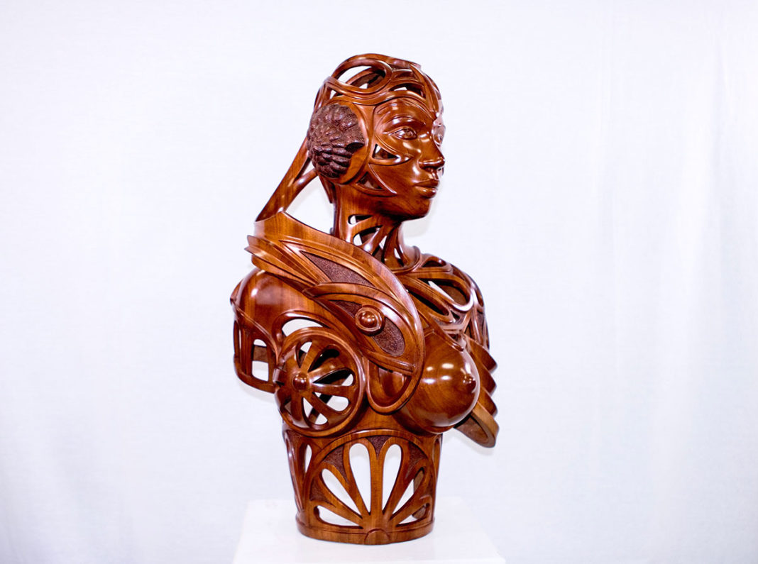 Big Wood this Weekend: Woodworking fest takes town - A close up of a gold statue - Wood