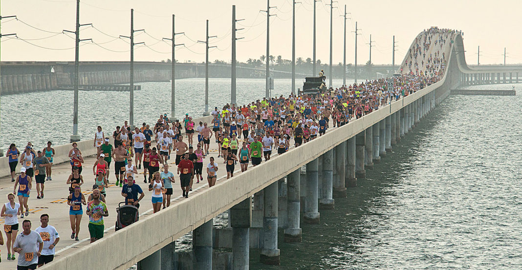 2019 runners set sights on 7 Mile Bridge Run - A group of people on a bridge over a body of water - Seven Mile Bridge