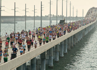 2019 runners set sights on 7 Mile Bridge Run - A group of people on a bridge over a body of water - Seven Mile Bridge