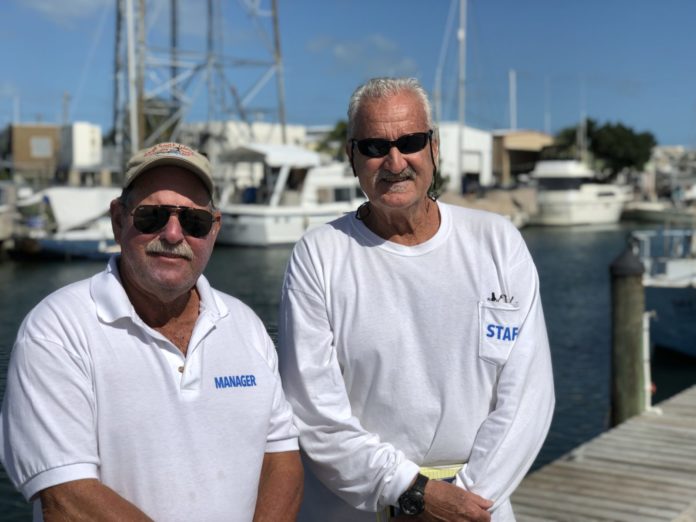 BY LOCALS, FOR LOCALS – Marathon Boat Yard continues an important role - A man standing next to a dock - Boat