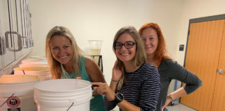 Octo-mom Gives Birth: Ground-breaking research at FKCC - A woman sitting on a counter - College of the Florida Keys