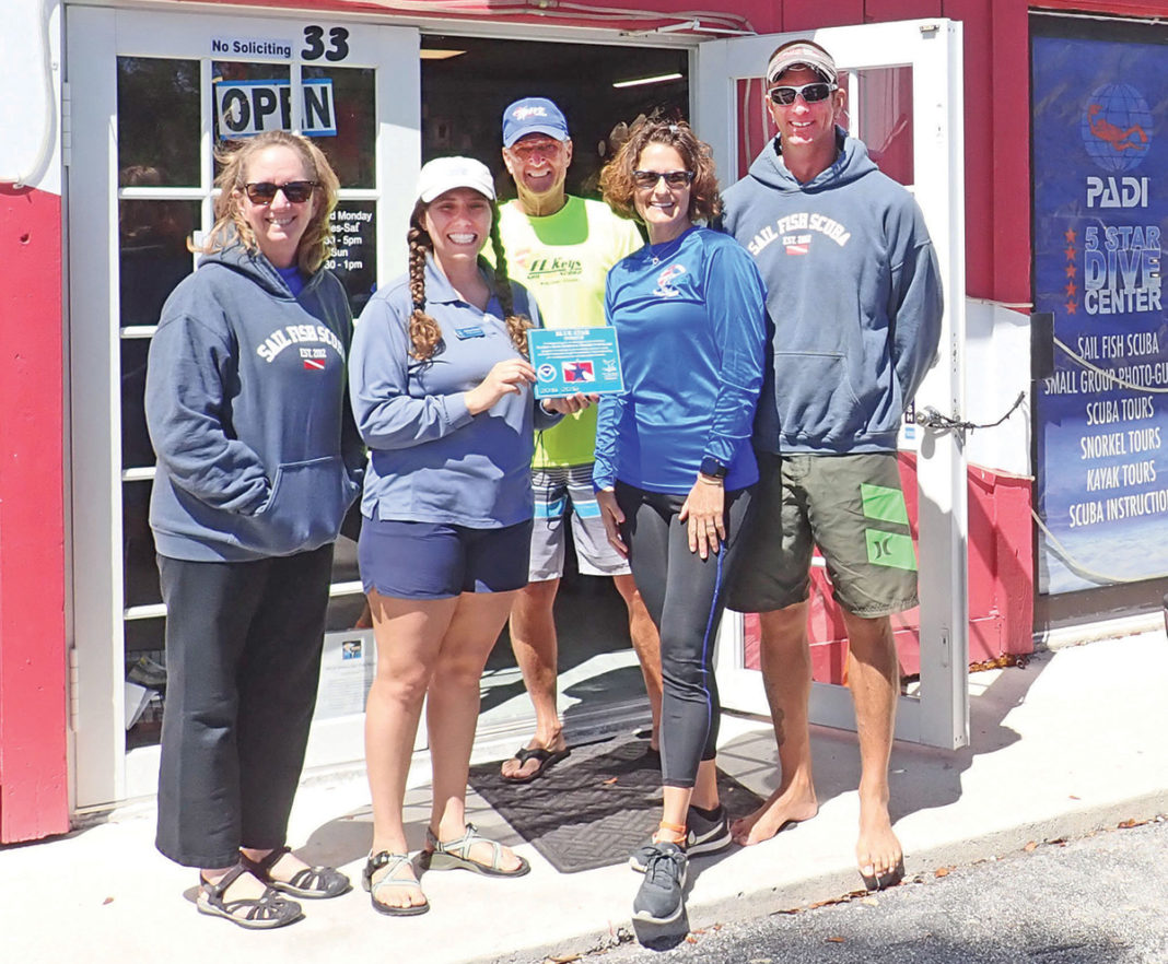 Blue Star adds diving, fishing operators - A group of people posing for the camera - Ultramarathon
