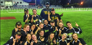 Dominating season ends with trophy, accolades - A group of people posing for a photo - College softball