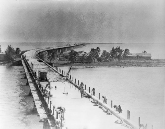 WIDENING THE BRIDGE  – Keys History - A vintage photo of a boat next to a body of water - Overseas Highway