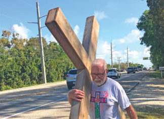 Marlin to carry cross for 33rd time - A man that is standing in the street - Islamorada