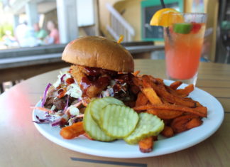 Some good shark bite in Key Largo Some good shark bite in Key Largo - A sandwich sitting on top of a plate of food on a table - French fries