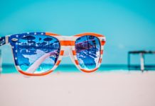 How to best Honor Memorial Day? Thoughts on the holiday from our Publisher, Britt Myers - A blue and yellow sunglasses taking a selfie - Independence Day