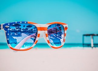 How to best Honor Memorial Day? Thoughts on the holiday from our Publisher, Britt Myers - A blue and yellow sunglasses taking a selfie - Independence Day