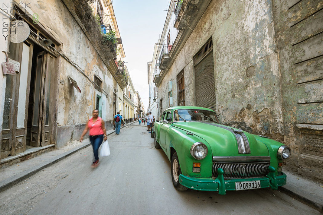 New travel rules make it harder to get to Cuba - A close up of a boy in a green car parked on a sidewalk - Florida Keys